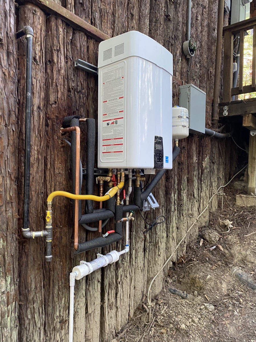 Outdoor tankless installation completed by Golden Bay Plumbing